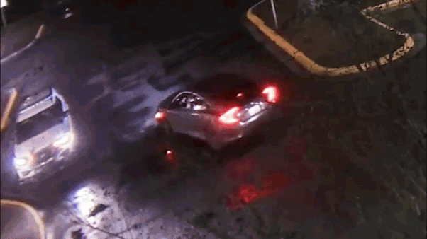 Video shows police officer ambushed in patrol car in explosion of gunfire; suspect found dead after shootout